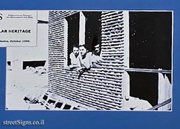 Merhavia - Heritage Sites in Israel - Mud House - A family  at the window of Mud House